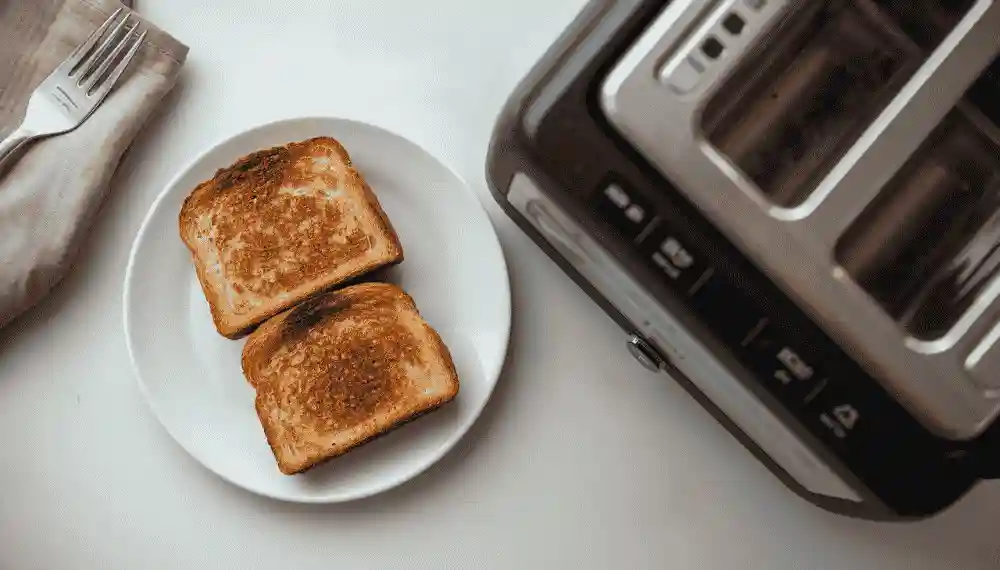 Evenly browned toast slices from a compact toaster oven tested for an apartment kitchen